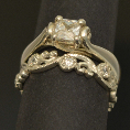 pacific treasures     R346 DIAM SET KORU WEDDING RING  3-482
